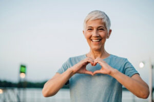 Woman making heart gesture with her hands