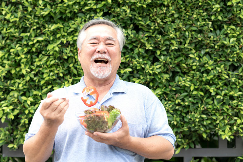 man enjoying a salad