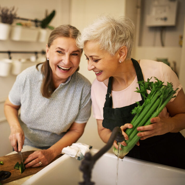 Women chopping vegetables